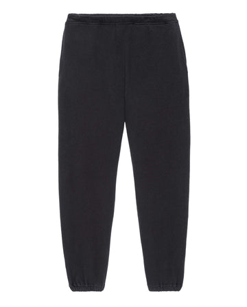 THE GREAT. HOL 21 MENS The Men's Stadium Sweatpant in Almost Black, featuring an elastic waistband and elastic cuffs, proudly made in the U.S.A., displayed against a white background.