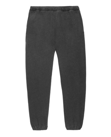 A pair of The Men's Stadium Sweatpant in Washed Black from THE GREAT. HOL 21 MENS, with an elastic waistband and cuffs, laid flat on a white background, exudes a vintage athleticwear vibe perfect for casual days in Los Angeles.