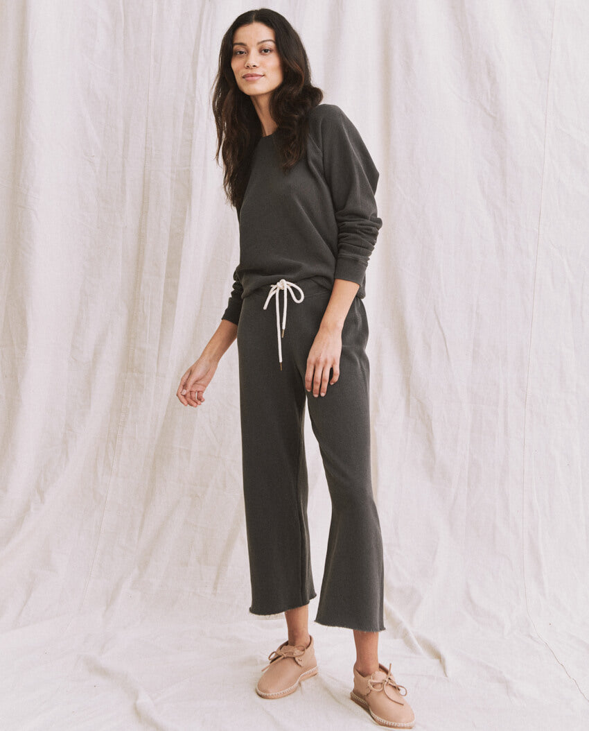 The Wide Leg Cropped Sweatpant. -- WASHED BLACK SWEATPANTS THE GREAT. CORE KNITS