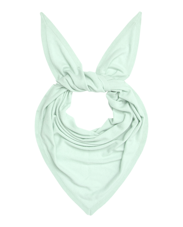 The Cashmere Kerchief Scarf in Mint by THE GREAT. H25 CASHMERE is a light green triangular cashmere scarf with two pointed ends reminiscent of bunny ears.