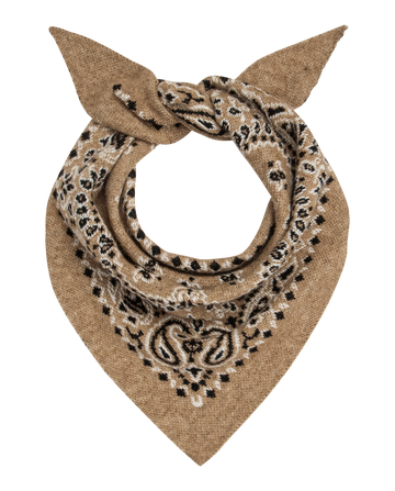 The Bandana Kerchief in Camel from THE GREAT. H25 COLLECTION, featuring a black and white paisley pattern, is tied in a knot at the top and displayed on a white background.
