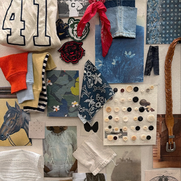 A collage of clothing items, fabric swatches, patches, buttons, a braided belt, printed images, and a red bandana arranged on a flat surface.