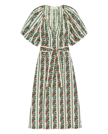 The Fairground Dress by THE GREAT. PS26 is a knee-length pullover with a v-neckline, short puff sleeves, belted waist, and tapestry floral stripe pattern on white.