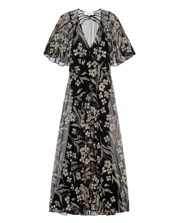 The Festal Dress – Brocade Floral by THE GREAT. H25 COLLECTION features a black floor-length design with a deep V-neck, flutter sleeves, and intricate white floral embroidery.