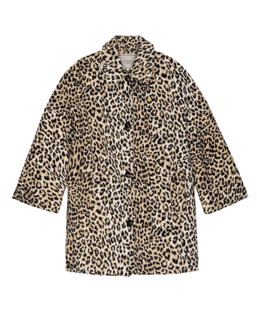 The Car Coat. -- Vintage Leopard by THE GREAT. F25 COLLECTORS features knee-length, long sleeves, beige and black faux fur leopard print, button front closure, classic collar, and quilted satin lining. Displayed on a white background.