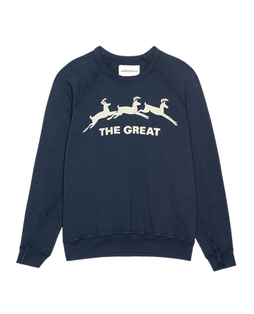 The Little College Sweatshirt by THE GREAT. H25 features a navy design with three playful leaping deer and "THE GREAT" printed in white on the front.