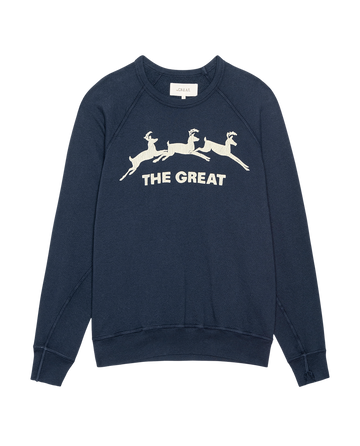 The Mens College Sweatshirt by THE GREAT. H25 MAN HOLIDAY GRAPHICS features a navy color with a deer graphic of three leaping reindeer and "THE GREAT" in white text on the front.