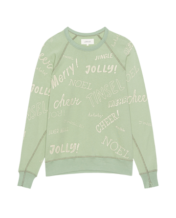 The Mens College Sweatshirt by THE GREAT. H25 MAN HOLIDAY GRAPHICS is a vintage mint men’s pullover featuring holiday greetings like “Merry!”, “Jolly!”, “Tinsel,” and “Cheer!” in white and beige across the fabric.