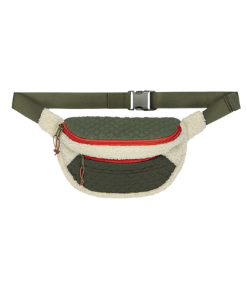 The Plush Colorblock Hip-Pack in Cream & Army by THE GREAT. F25 TGO features a red zipper, adjustable olive strap, and two zippered compartments—perfect for outdoor, cold weather adventures.