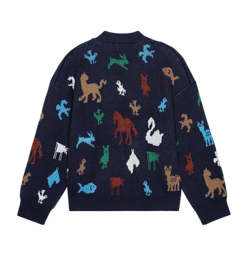 The Pictograph Slouch Cardigan in navy by THE GREAT. PS26 features colorful animal silhouettes—like lions, horses, swans, and dogs—scattered across the back.