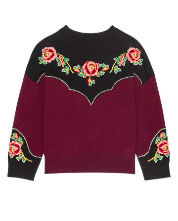 The HEIRLOOM ROSE WESTERN PULLOVER by THE GREAT. H25 COLLECTION features a black upper, wine lower section, and floral embroidery with heirloom rose motifs on the chest and sleeves.