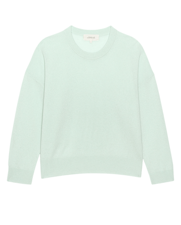 The Cashmere Crew in Mint by THE GREAT. H25 CASHMERE is displayed flat on a white background, highlighting its effortlessly luxurious knitwear style.