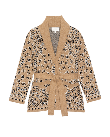 The Bandana Riding Cardigan in camel by THE GREAT. H25 COLLECTION features a black and white floral pattern, shawl collar, and matching waist belt, displayed flat on a white background.