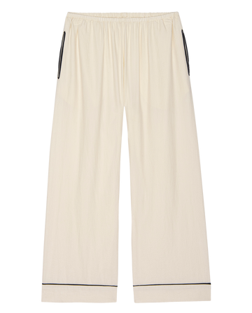 The Flannel Western Easy Sleep Pant in Cream & Black by THE GREAT. H25 SLEEP features wide legs, an elastic waistband, black trim on pockets and hem, and a relaxed fit—ideal for effortless western-inspired sleepwear.