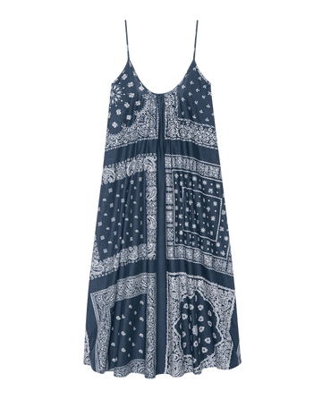 The Slip Sleep Dress – Bandana Patchwork by THE GREAT. F25 SLEEP: a sleeveless navy dress with thin straps and a white bandana patchwork print, shown on a plain background.