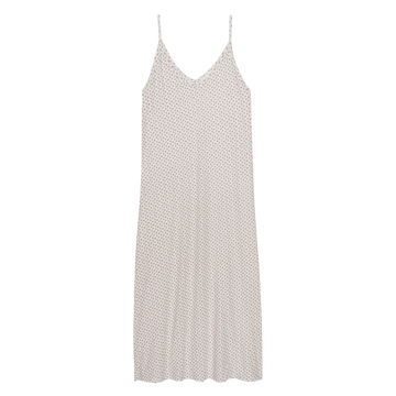 The Slip Sleeper V Neck Dress -- Calico Rose by THE GREAT. PS26 SLEEP is a sleeveless, knee-length jersey dress with thin spaghetti straps and a subtle small dot pattern on a light background.