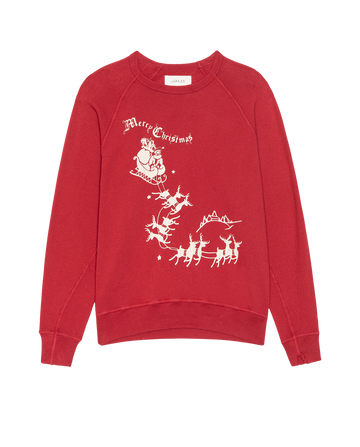 THE GREAT. H25 HOLIDAY GRAPHICS “The College Sweatshirt” in true red features a white sleigh graphic of Santa and reindeer with “Merry Christmas” text on the front.