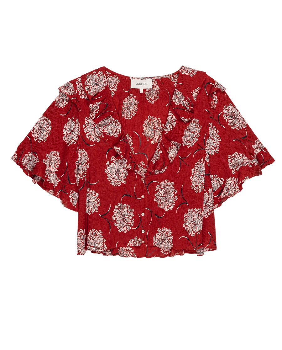 Add a pop of color with THE GREAT. SU25 The Bower Top in True Red Dancing Floral—featuring short sleeves, white floral print, ruffled neckline, and a flowy fit for effortless women’s style.