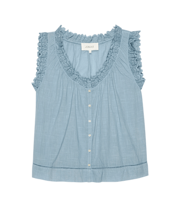 The Vignette Top by THE GREAT. PF25 is a sleeveless pale blue blouse featuring lace-trimmed V-neck and armholes, button-down front, and a slightly flared hem.