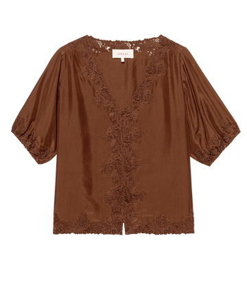 The GREAT. F25 D1 Short Sleeve Legacy Top in Chocolate features a deep V-neck and embroidered mesh lace trim on the neckline, sleeves, and hem, crafted from silky fabric inspired by 1920s loungewear.