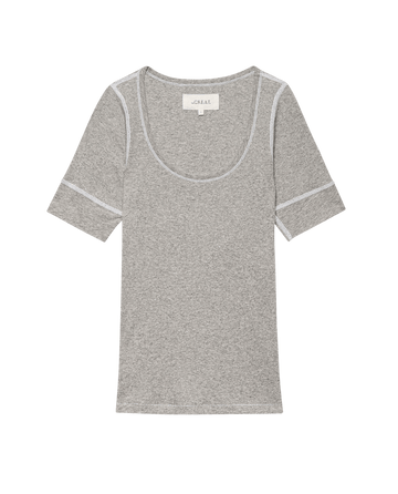 The Baby Rib Ballet Tee in heather grey by THE GREAT. SU25 BABY RIB features short sleeves, baby rib fabric, white stitching, and a scoop neckline, shown flat on a black background.