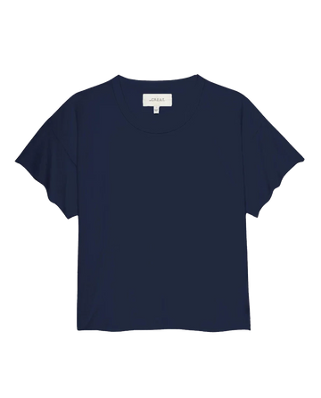 The Crop Tee in True Navy from THE GREAT. FALL 23 KNITS, featuring short sleeves and a super soft cotton fabric with a round neckline, showcased against a white background. Ideal for pairing with high-rise jeans to achieve a chic, casual look.