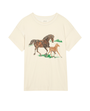 The Boxy Crew by THE GREAT. PF25 in washed white features running horses and a foal on grass with green trees in the background.