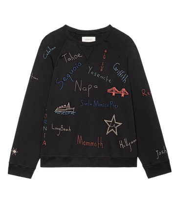 The Slouch Sweatshirt by THE GREAT. F25 D2 features colorful Golden State embroidery with names and images of iconic California landmarks like Napa, Yosemite, Hollywood, Long Beach, and the Golden Gate Bridge.