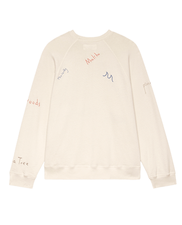 The Slouch Sweatshirt by THE GREAT. F25 D2 features Golden State embroidery on a washed white, vintage-inspired design, shown against a plain white background.