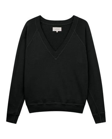 A V-neck sweatshirt named "The V-Neck Sweatshirt" in Almost Black from THE GREAT. FALL 24 KNITS, with long sleeves, displayed against a white background, crafted with precision in Los Angeles.