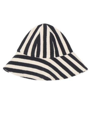 The Bucket Hat by THE GREAT. SU26 in Navy Shoreside Stripe features wide alternating diagonal and vertical navy-and-white stripes, shown on a plain white background.