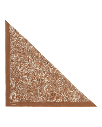 The Stetson Western Paisley Scarf in Rust by THE GREAT. F26 STETSON is a classic vintage-inspired bandana, folded diagonally and adorned with white intricate paisley patterns across the fabric—perfect for adding a Western touch to any look.