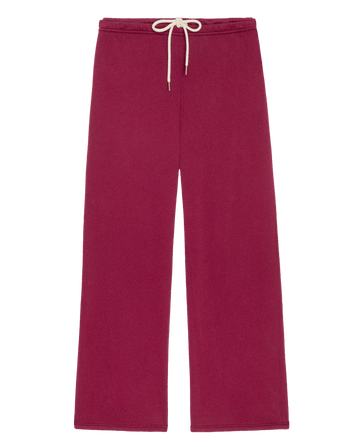 The Fleece Lap Sweatpant in plum, featuring a wide-leg fit in fleece with a cream drawstring waist.