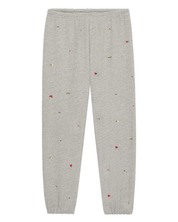 The Stadium Sweatpant W/ Tossed Floral Emb. by THE GREAT. SU26 in Varsity Grey features an elastic waistband and cuffs, plus scattered colorful floral embroidery for a playful twist on vintage athletic style.