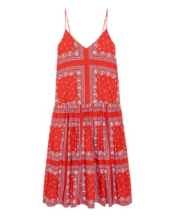 THE GREAT. SU26 "The Drop Waist Dress" in Red Sailboat Bandana, a sleeveless red dress with thin straps and blue and white geometric paisley print, shown on a white background.