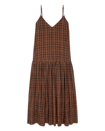 The Drop Waist Dress in Woodcrest Plaid by THE GREAT. F26 D1 features a sleeveless brown and black plaid design with thin straps and a flared skirt, shown against a plain white background.