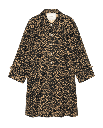The Trench Coat. -- Dark Leopard by THE GREAT. F26 COLLECTORS features a striking leopard print, classic collar, button-down front, and cuffed sleeves, offering a bold update to traditional women's outerwear—shown here on a white background.