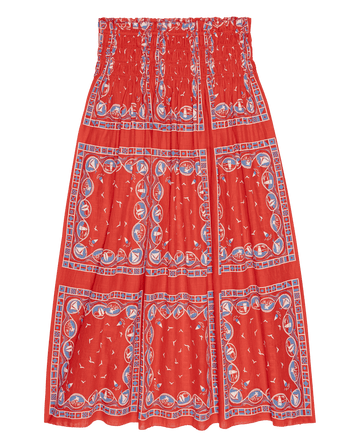 The Canary Skirt – Red Sailboat Bandana by THE GREAT. SU26 is a red midi skirt with a gathered waistband and blue, white, and red nautical geometric patterns in square panels—an eye-catching women's fashion piece.