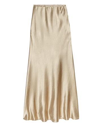 The Elastic Bias Skirt in Gold Shimmer, a gold bias-cut midi skirt with an elastic waistband.