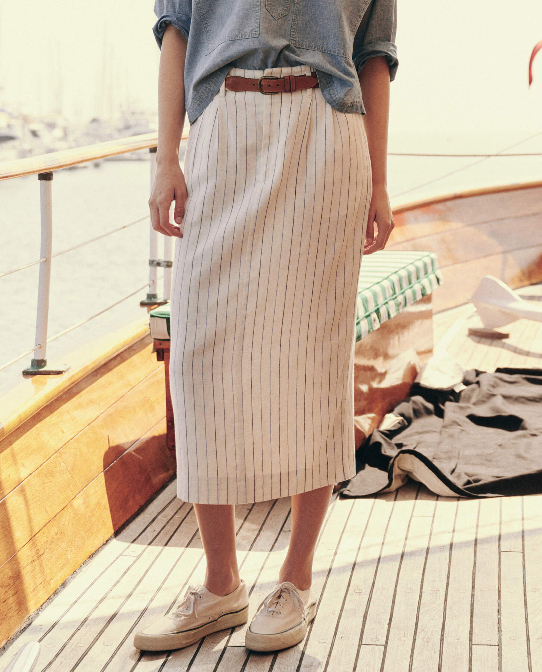 The Pleated Column Skirt. -- Cream Pinstripe SKIRTS THE GREAT. SU24