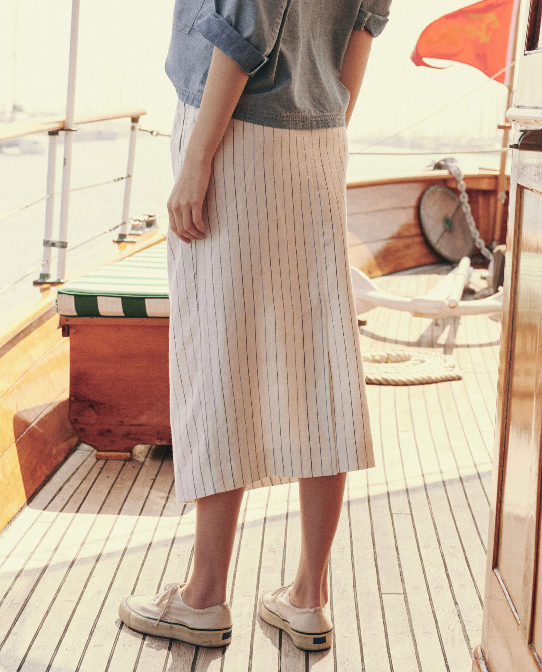 The Pleated Column Skirt. -- Cream Pinstripe SKIRTS THE GREAT. SU24