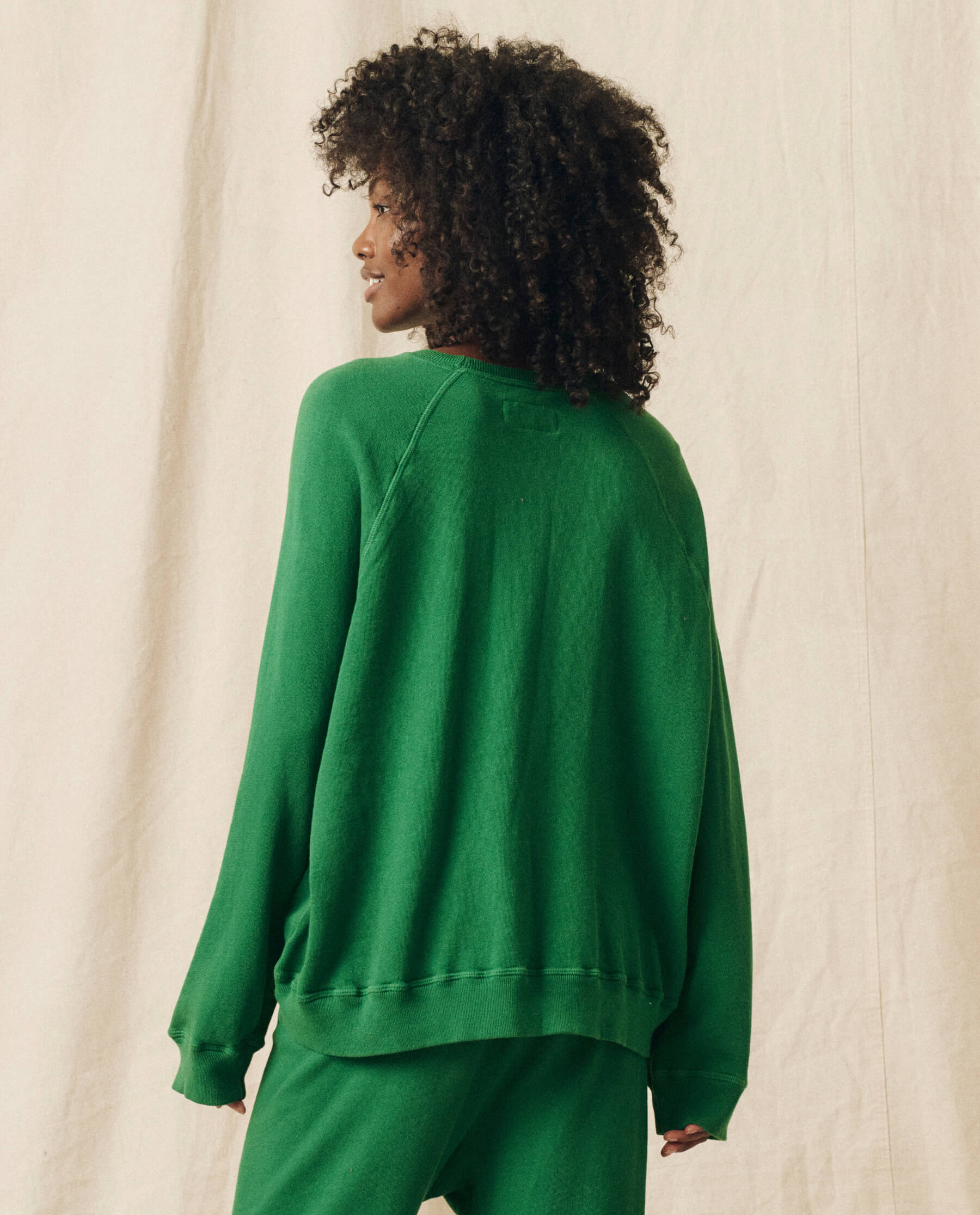 The Slouch Sweatshirt. Solid -- Holly Leaf SWEATSHIRTS THE GREAT. HOL 23 KNITS