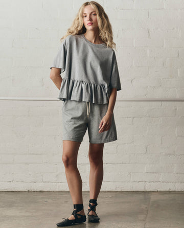 The Oversized Ruffle Peplum Tee. -- Heather Grey – The Great.