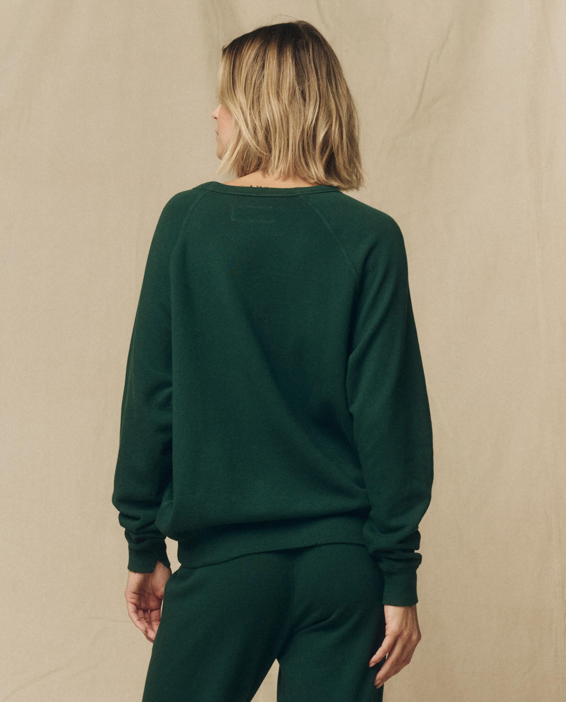 The College Sweatshirt. Solid -- Green Grove SWEATSHIRTS THE GREAT. FALL 23 KNITS