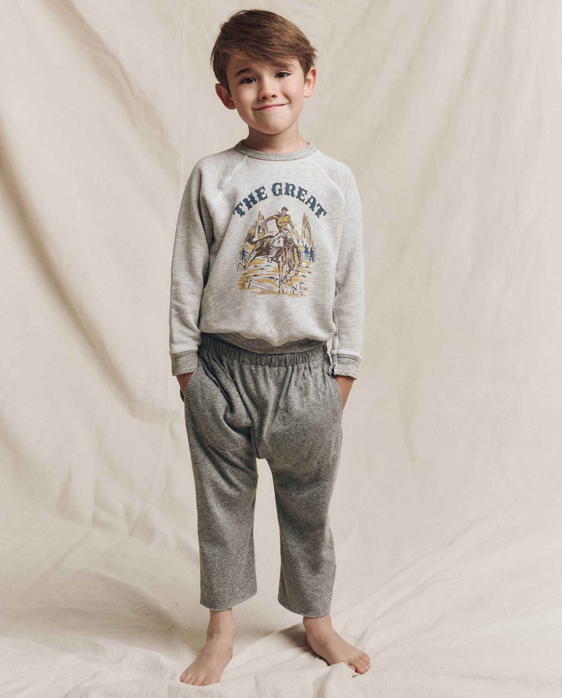 The Little College Sweatshirt. Graphic -- Soft Heather Grey with Rodeo Graphic SWEATSHIRTS THE GREAT. FALL 24 LITTLE