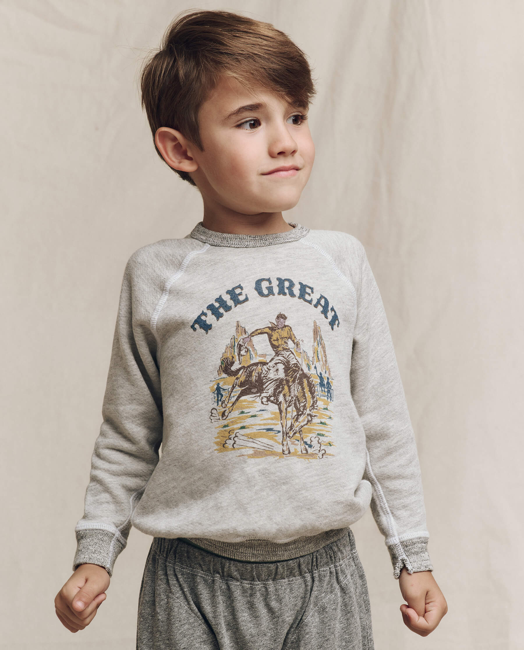 The Little College Sweatshirt. Graphic -- Soft Heather Grey with Rodeo Graphic SWEATSHIRTS THE GREAT. FALL 24 LITTLE