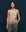 Against a dark background, a woman stands wearing "The Legacy Top” by THE GREAT. SP25 COLLECTORS in nude, featuring a stylish lace-trimmed camisole design, paired with green pants.