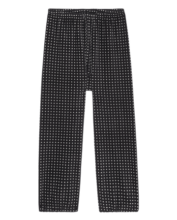 The Campfire Sweatpant. -- Black Dot by THE GREAT. F26 TGO features a white polka dot pattern and drawstring waist, shown on a white background.