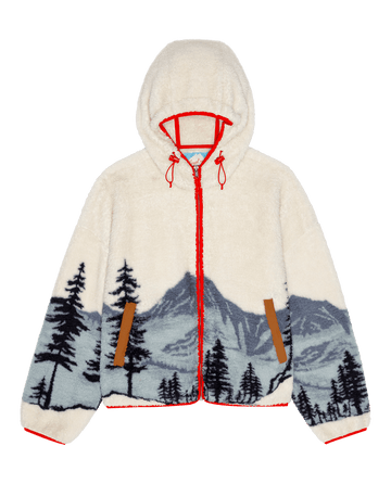 The Plush Horizon Full Zip. -- Snowcap View Landscape by THE GREAT. F26 TGO: cream plush hoodie with red trim, brown pockets, and blue mountain landscape design.