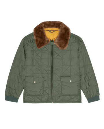 The Reversible Logger Puffer. -- Pine And Amber by THE GREAT. F26 TGO features a green quilted design, brown faux fur collar, zip front, snap pockets, ribbed cuffs, and yellow lining.